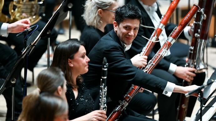 The woodwind section of the Royal Philharmonic Orchestra on stage