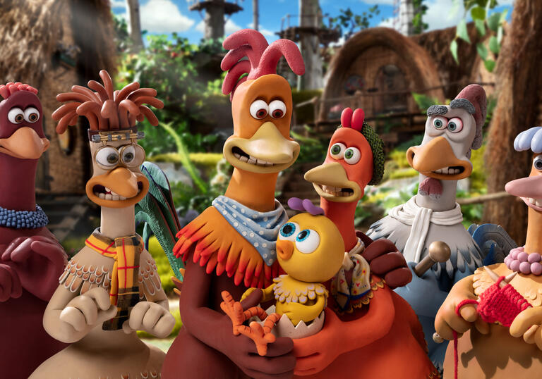 A family of chickens stand together for a family portrait.