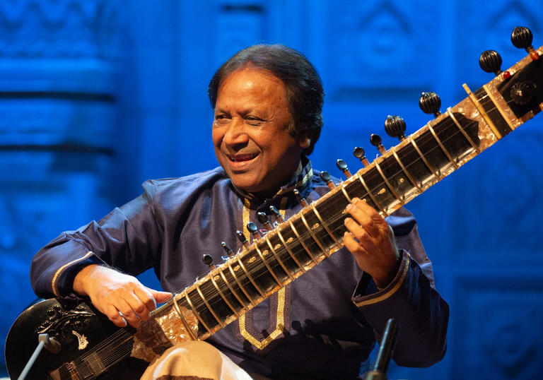 Ustad Shahid Parvez playing the sitar on stage