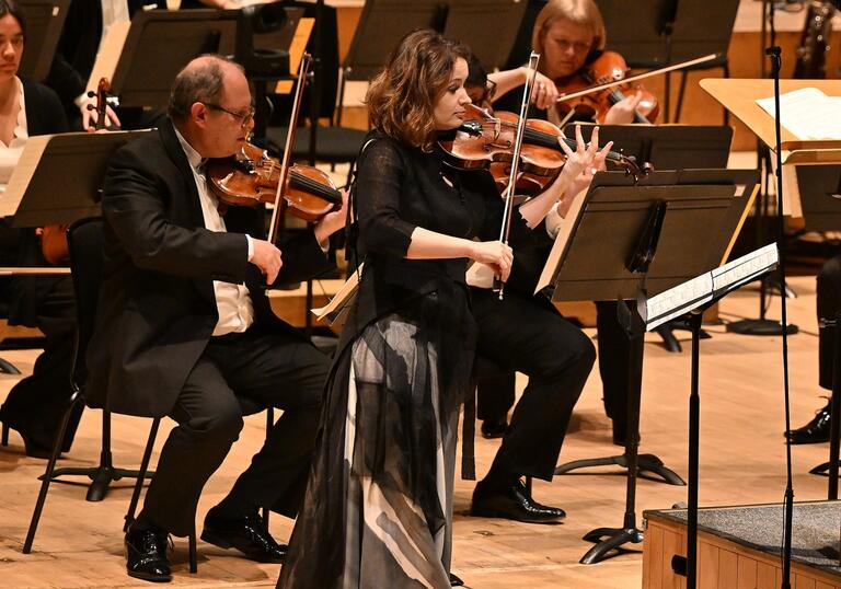 Patricia Kopatchinskaja on stage at the Barbican Hall playing her violin
