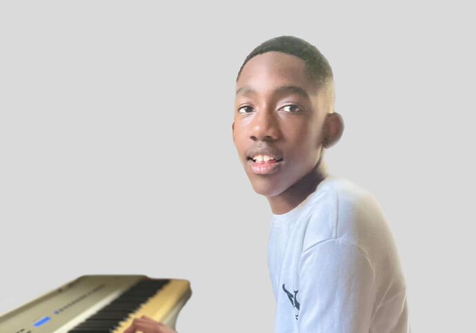 Jabari playing a piano