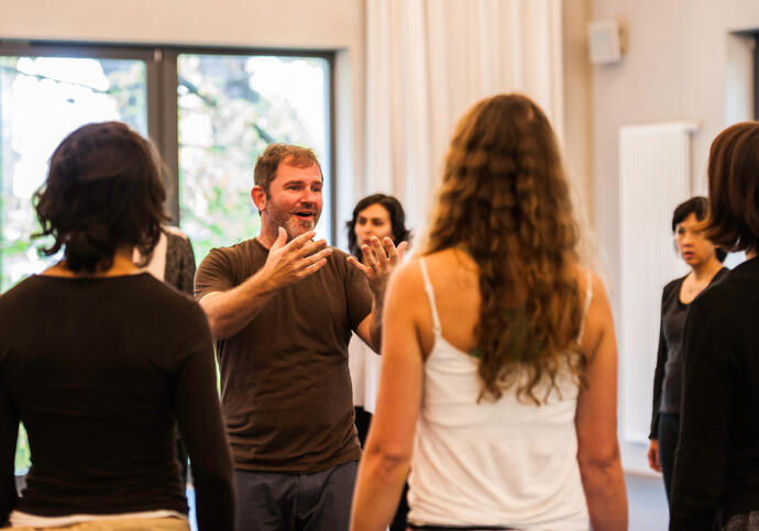 An image of participants in a singing workshop. 