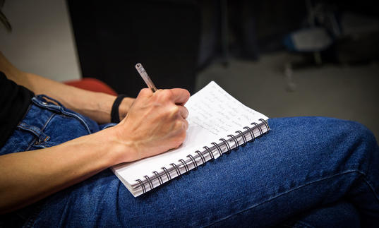 Close up of a notepad on a knee