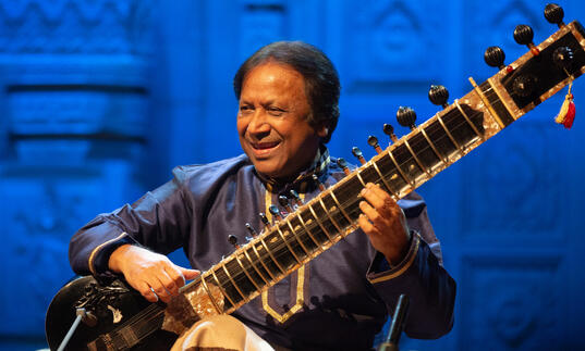 Ustad Shahid Parvez playing the sitar on stage