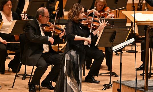 Patricia Kopatchinskaja on stage at the Barbican Hall playing her violin