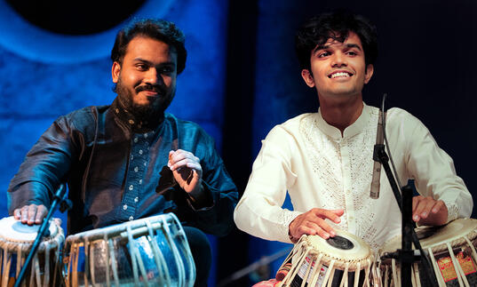 Image of Yashwant Vaishna and Vivek Pandya performing on stage