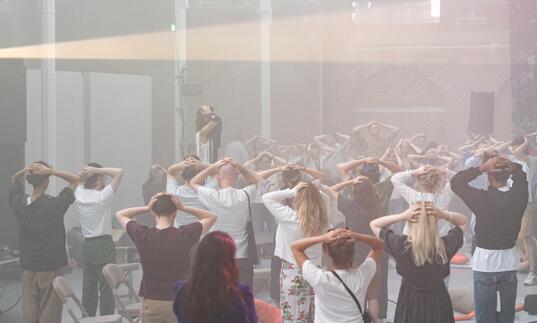 Participants in a somatic movement workshop